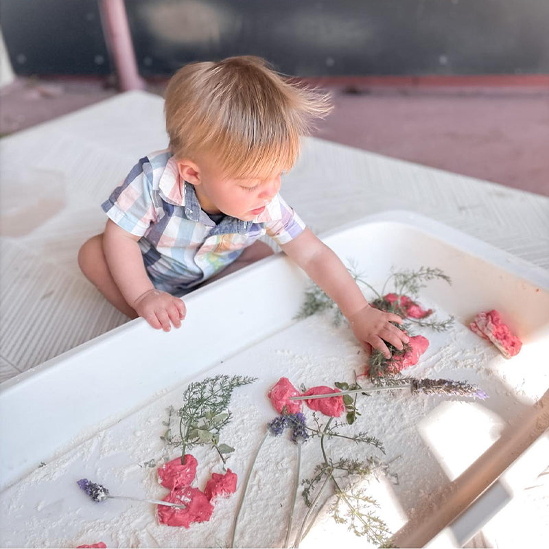 Boori Tidy Tray sitting on top of a Boori bassinet as a change station