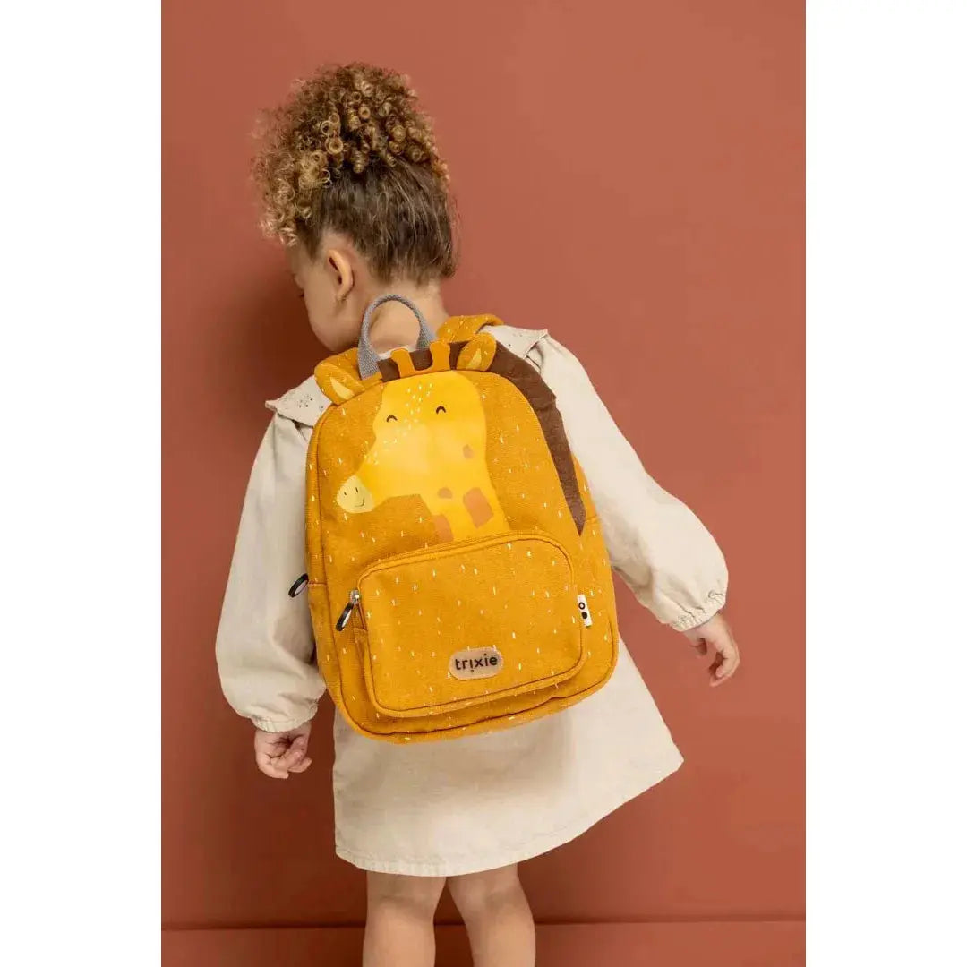 Open main compartment of Trixie Mr. Giraffe backpack showing interior space