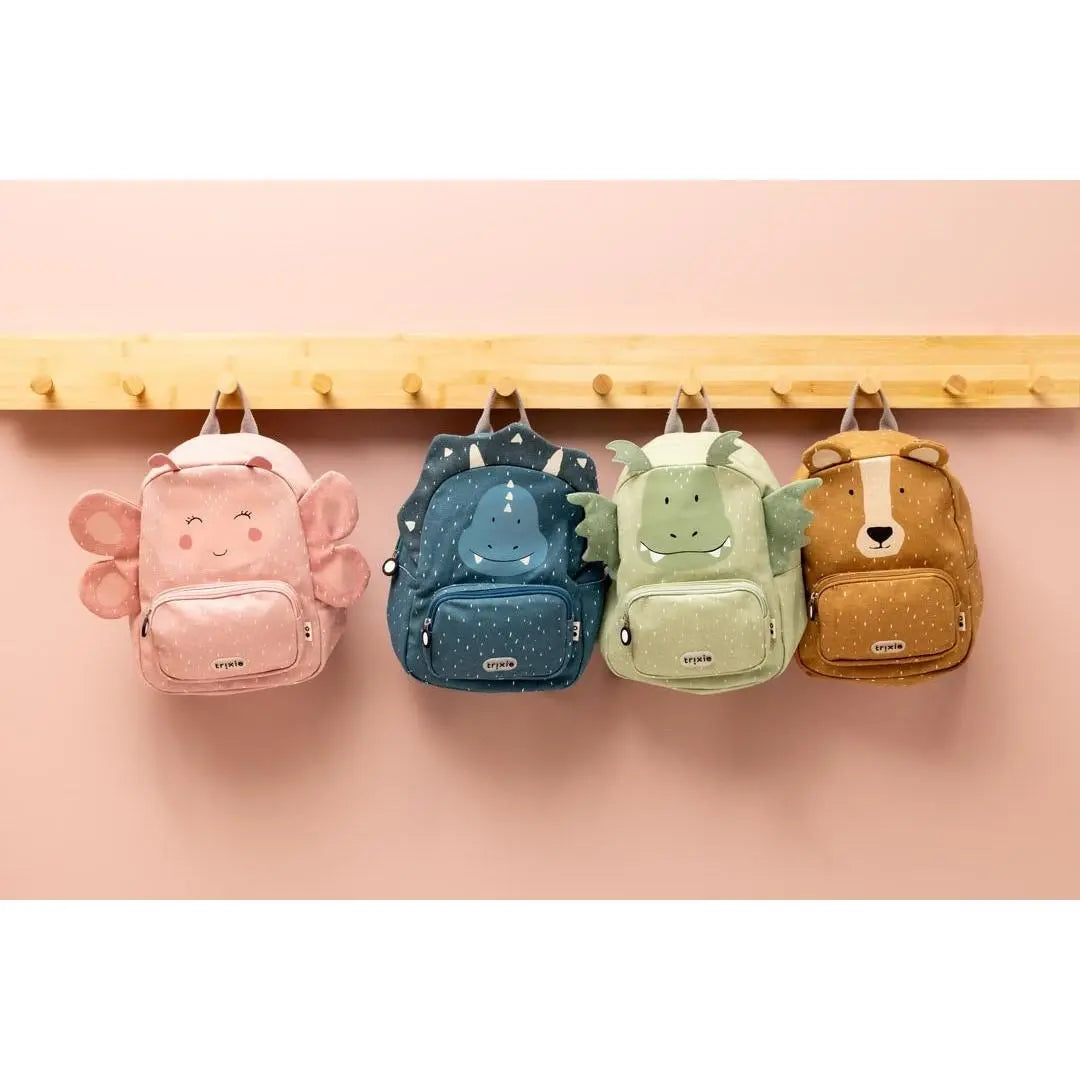 Child wearing Trixie Mr. Triceratops backpack – recycled cotton kids school bag