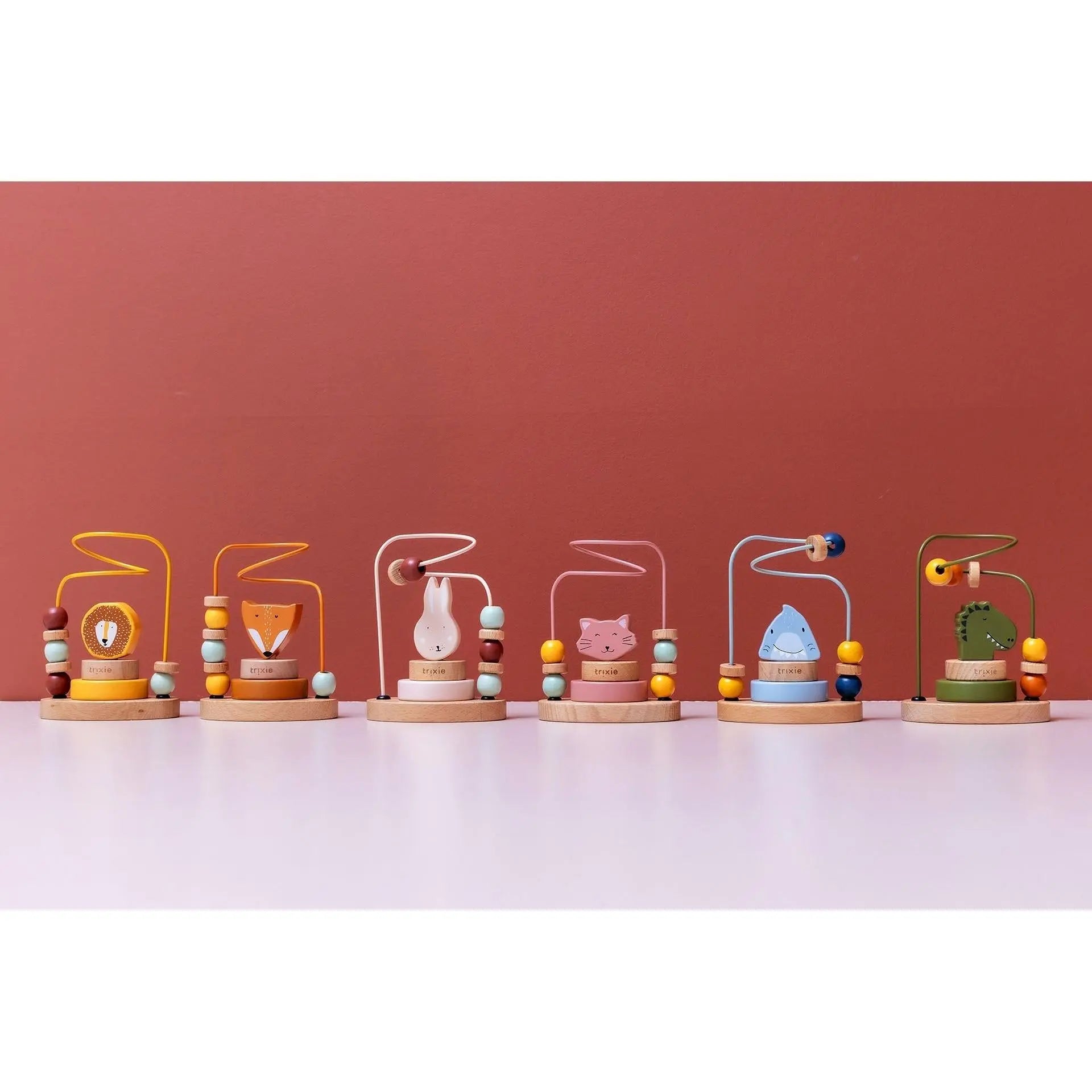 Trixie Mr. Dino beads maze with stackable dino character pieces for toddler play