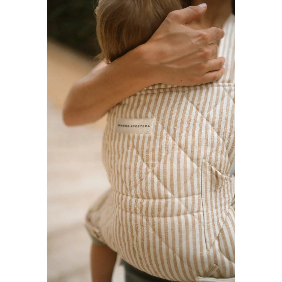 Woven Mumma Etcetera label on the quilted Burleigh stripe Daily Carrier