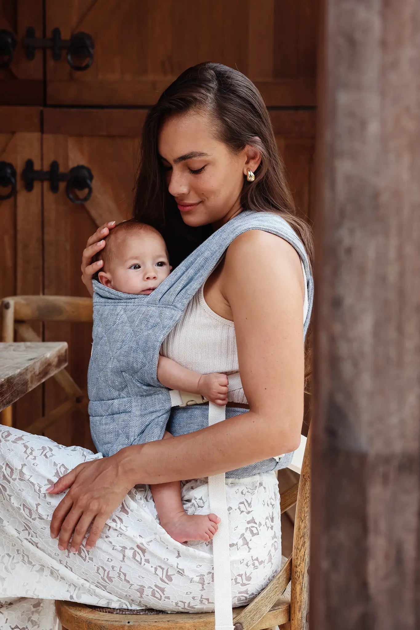 Newborn carried inward-facing in the Lane linen Mumma Etcetera Daily Carrier