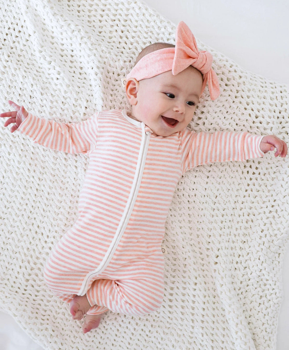 Lummi in Colour baby headband worn by a newborn