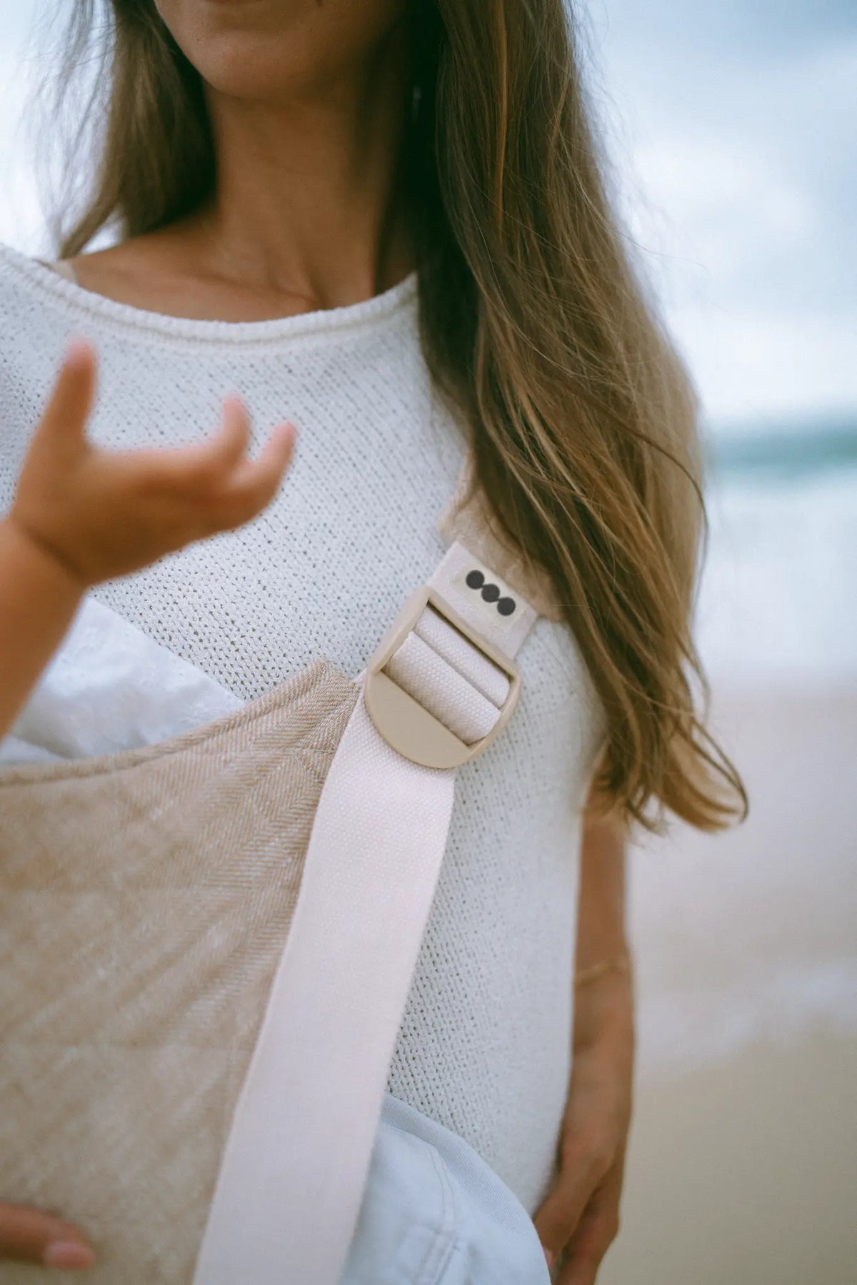 Close-up of the wide cupped shoulder strap on the Meadow linen Hipsy Carrier