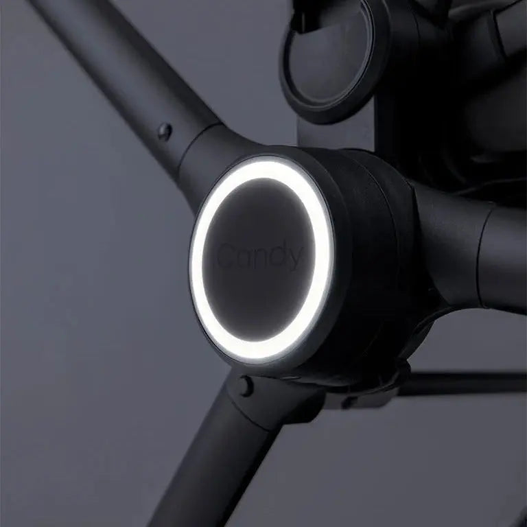 iCandy Core 2 Hub Light illuminated on pushchair chassis — close-up of LED light