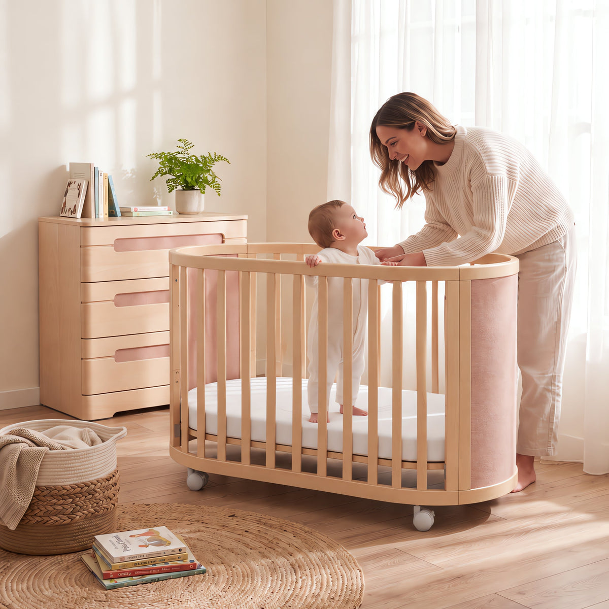 Mum settling baby in the Boori Eden Elite Oval Cot (shown in Cherry & Beech)