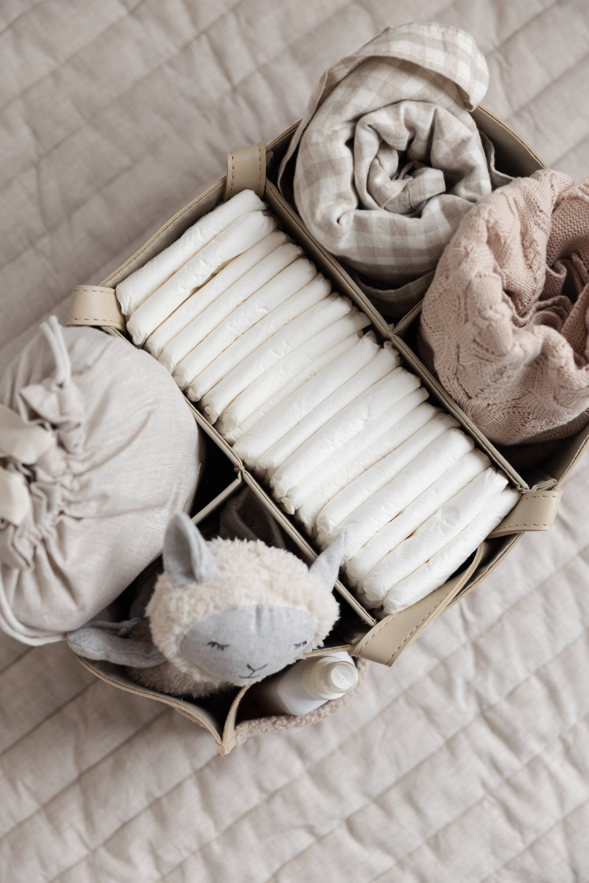 Linen Label Luxe Nappy Caddy in Nude packed with nursery essentials