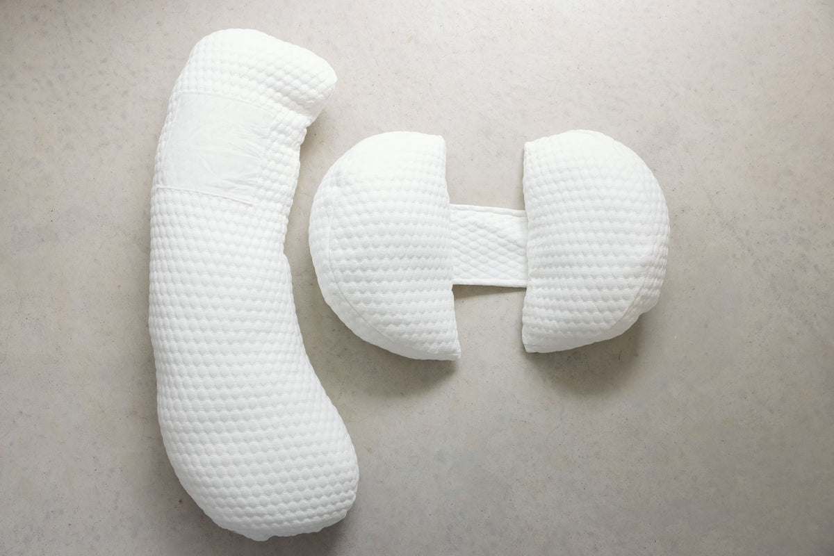 Linen Label large maternity pillow shown supporting bump and knees