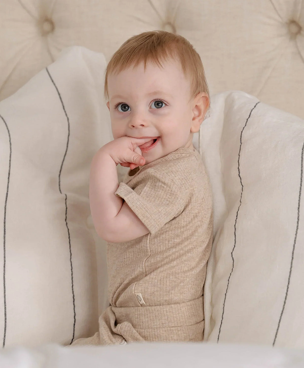 Lummi in Colour Heather Oat bodysuit showing the stud gusset