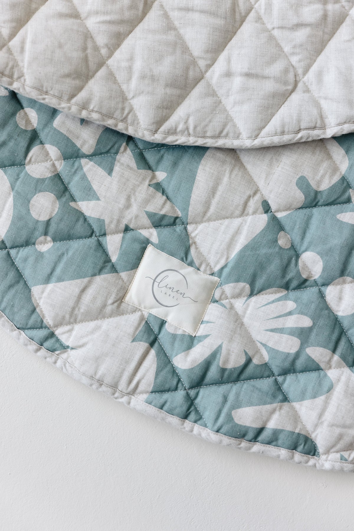 Linen Label round padded linen play mat in Opal Sage Print