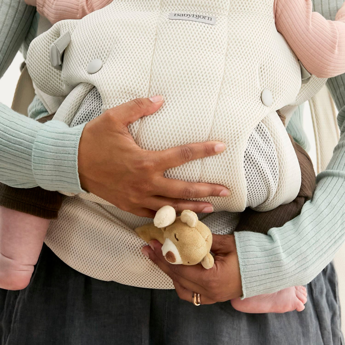 Close-up of the breathable Airy Mesh on the BabyBjorn Baby Carrier Hold Cream