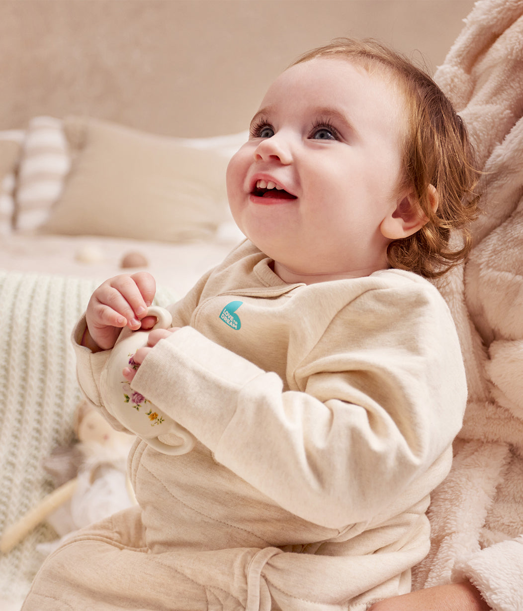 Baby asleep in Love to Dream Sleep Bag Long Sleeve 3.5 TOG Oatmeal Moon Quilting