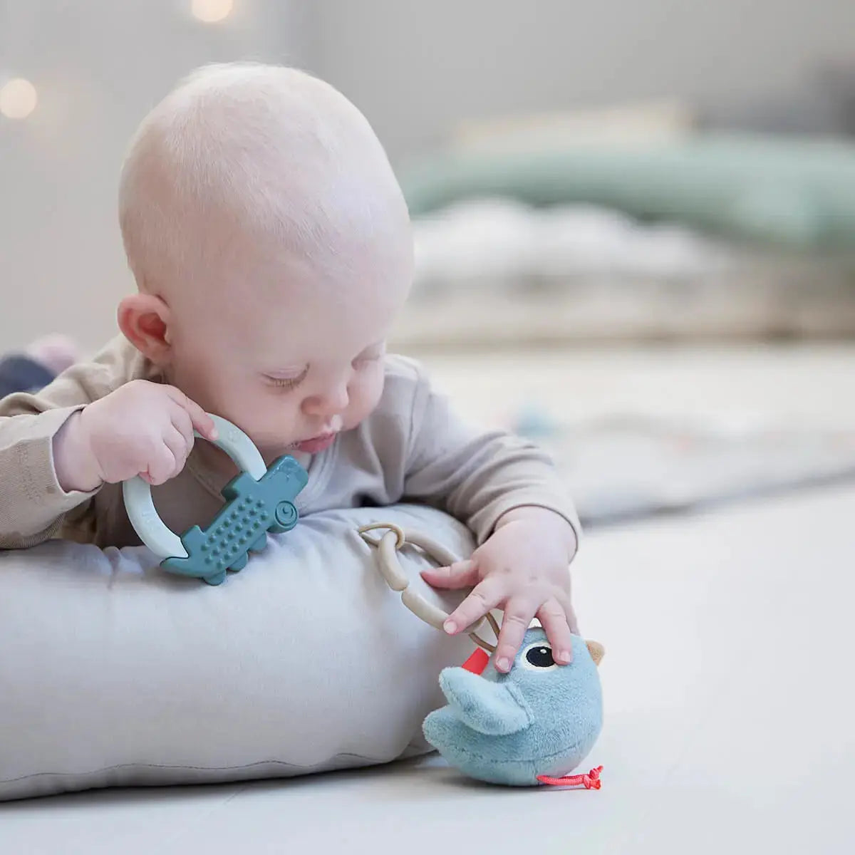 Done by Deer Cozy lounger with activity arch Raffi